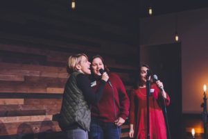 three women performing on stage