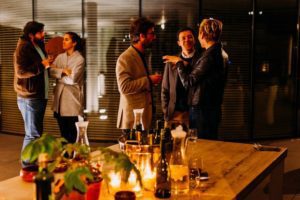 Employees at a gathering in the evening with a Corporate DJ