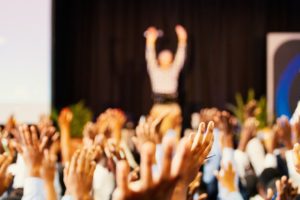 people raising their hands